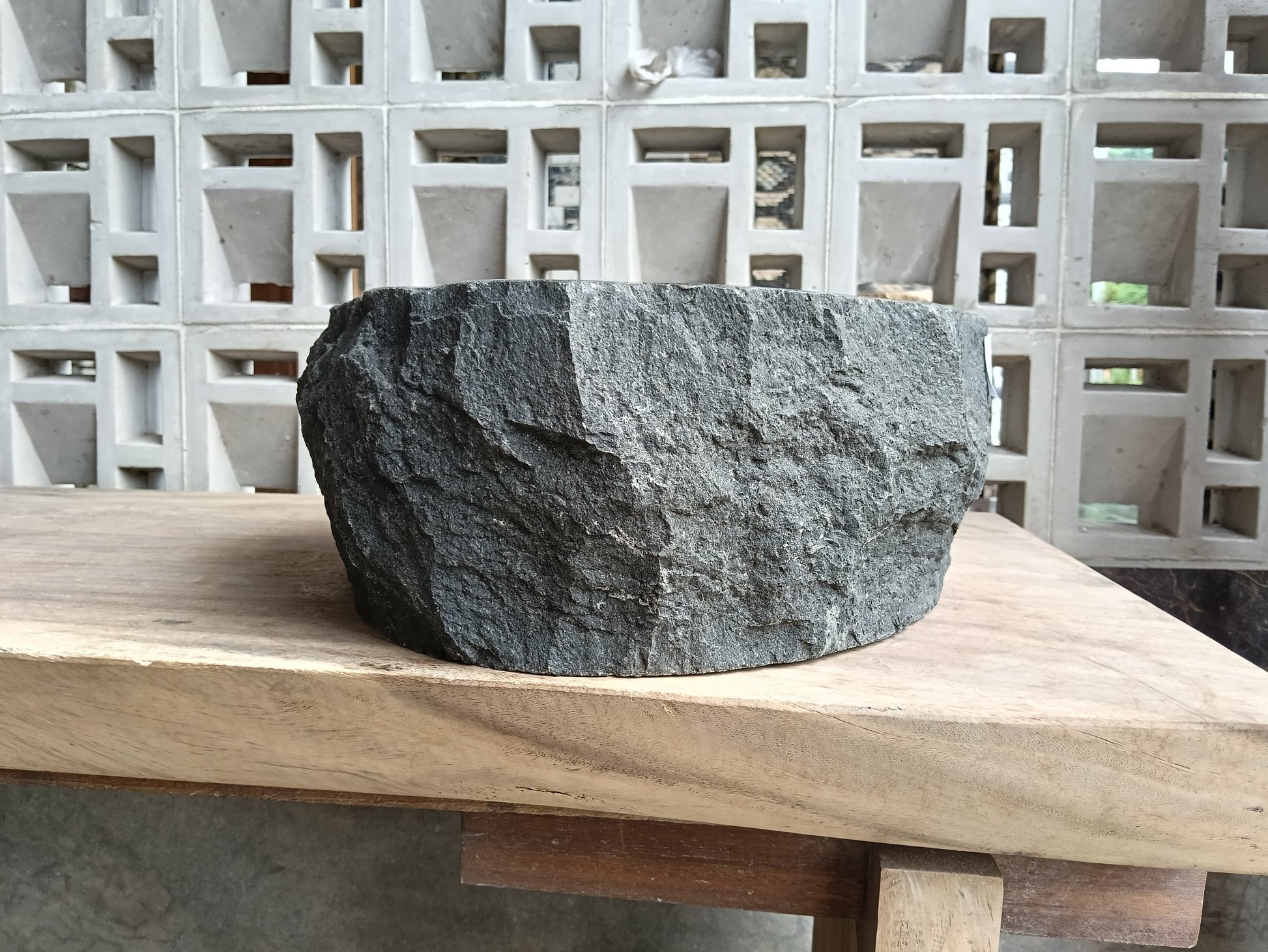 Right side of 60A4-4338 organic oval andesite stone sink — smooth interior
