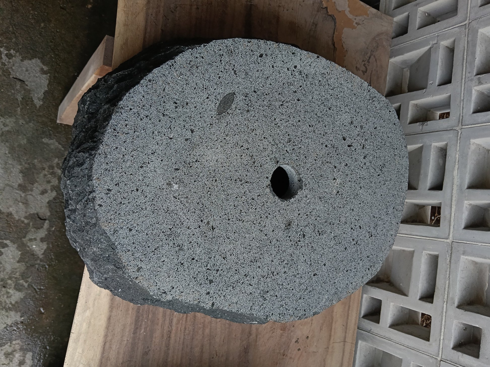 Bottom view of 6A24-5140 solid andesite stone sink — standard drain hole
