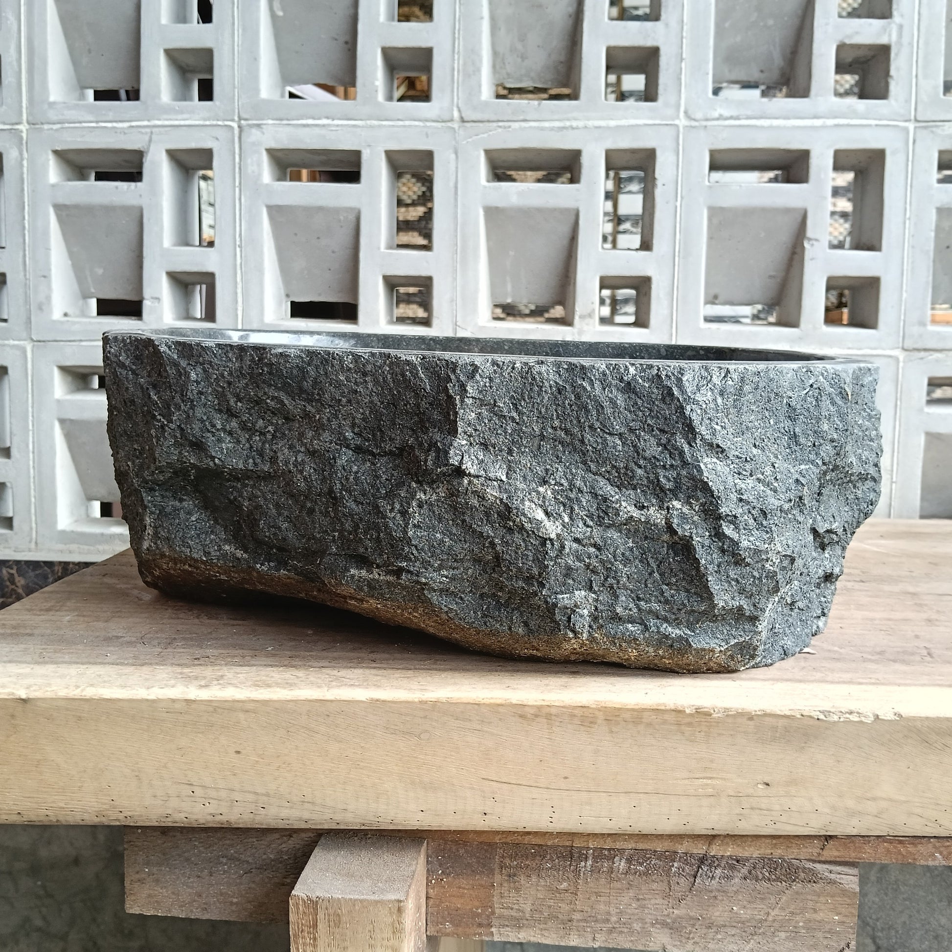 Back view of 6A29-4235 natural andesite basin — textured exterior surface
