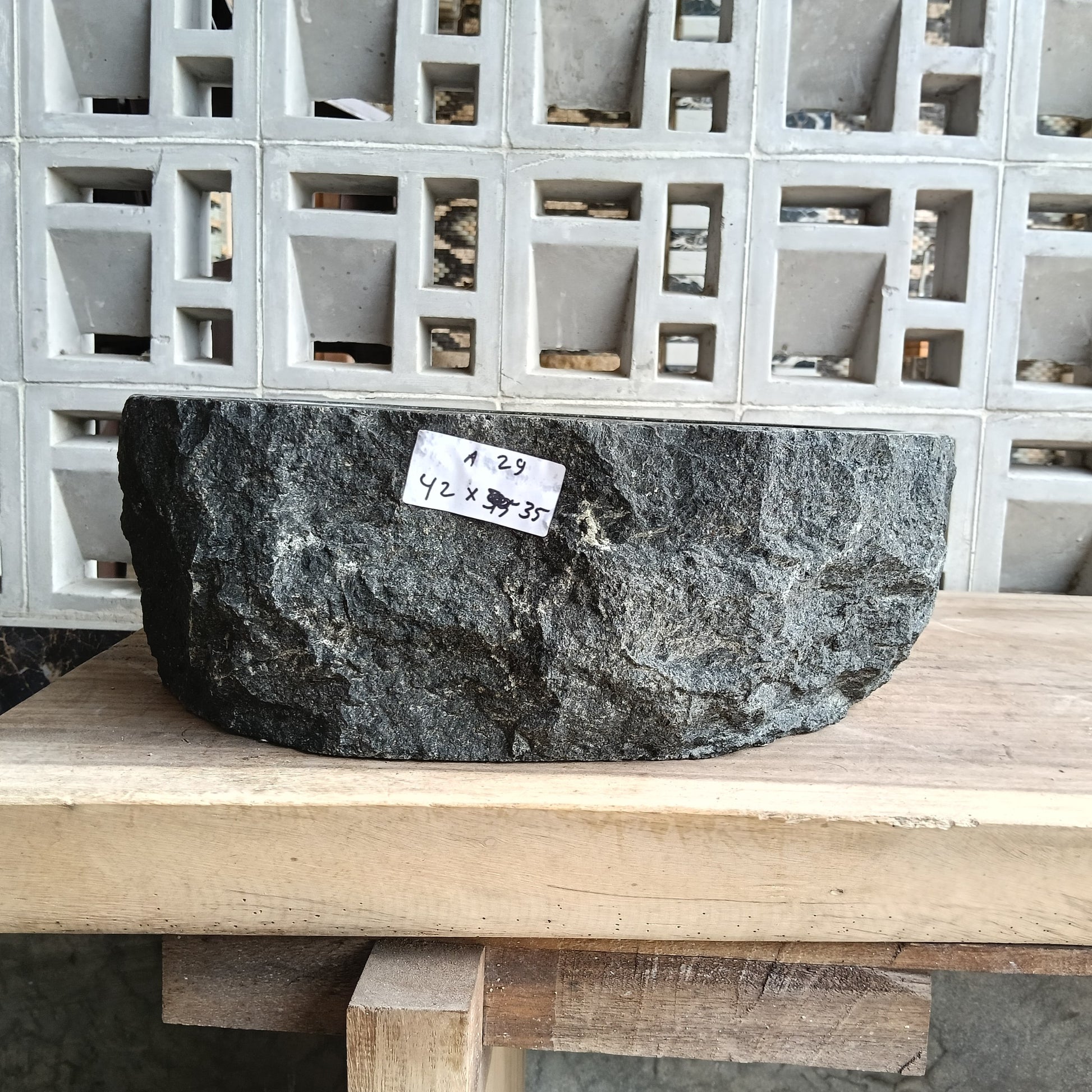 Front view of 6A29-4235 andesite stone vessel — polished interior bowl
