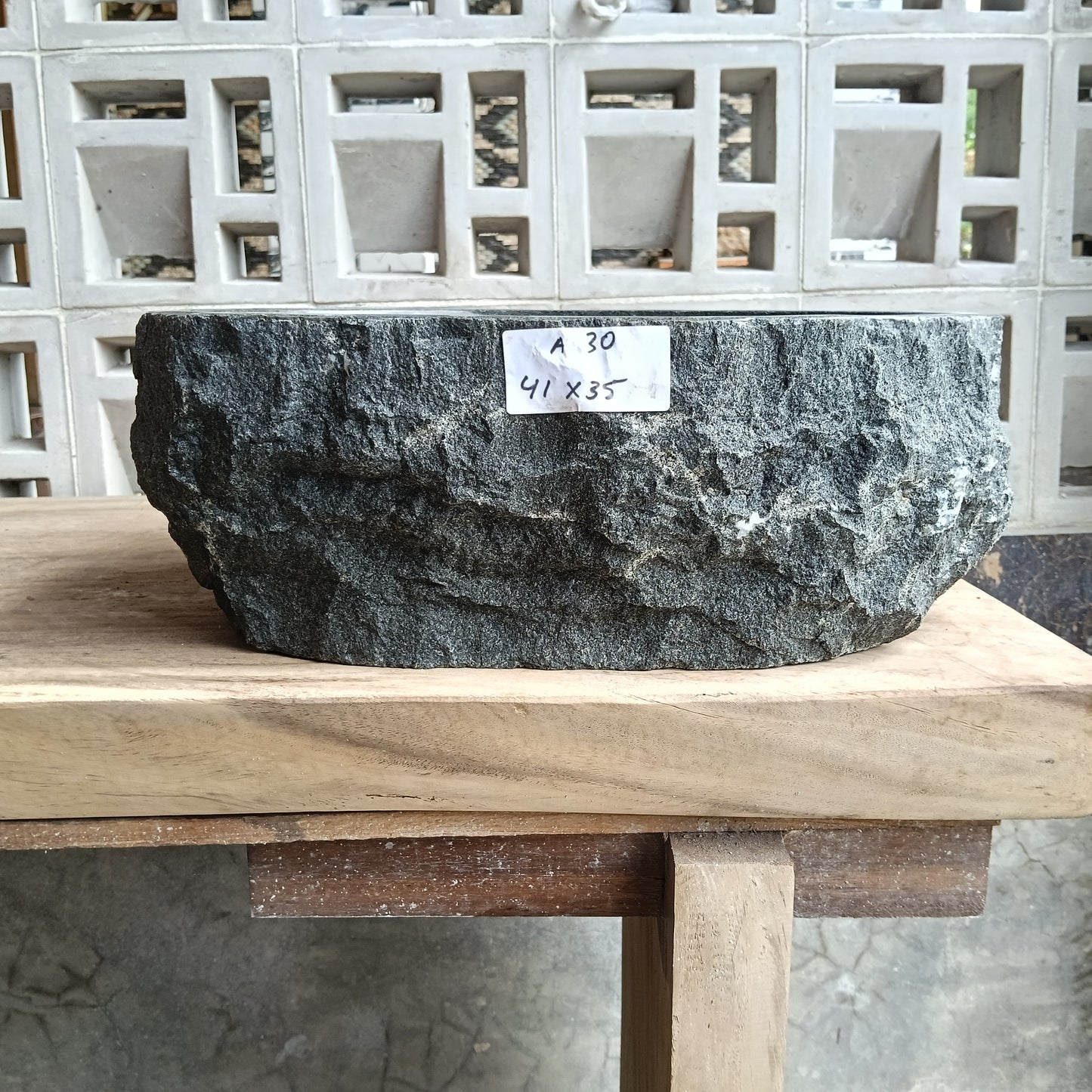 Front view of 6A30-4135 andesite stone vessel — polished interior bowl
