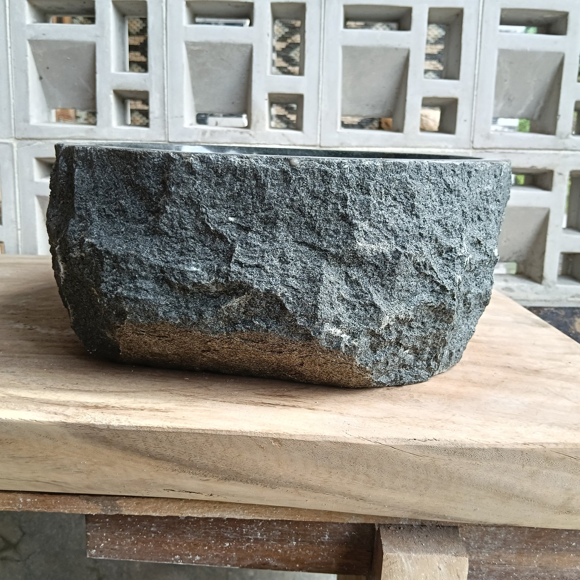 Back view of 6A30-4135 natural andesite basin — textured exterior surface
