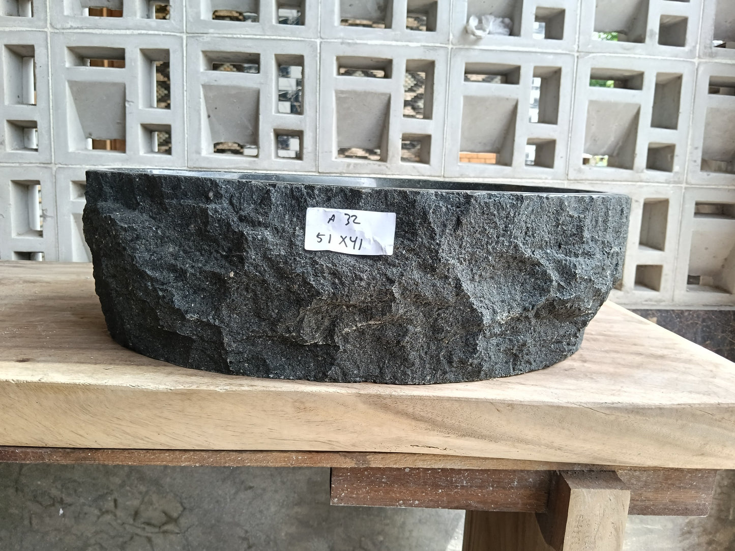 Front view of 6A32-5141 andesite stone vessel — polished interior bowl

