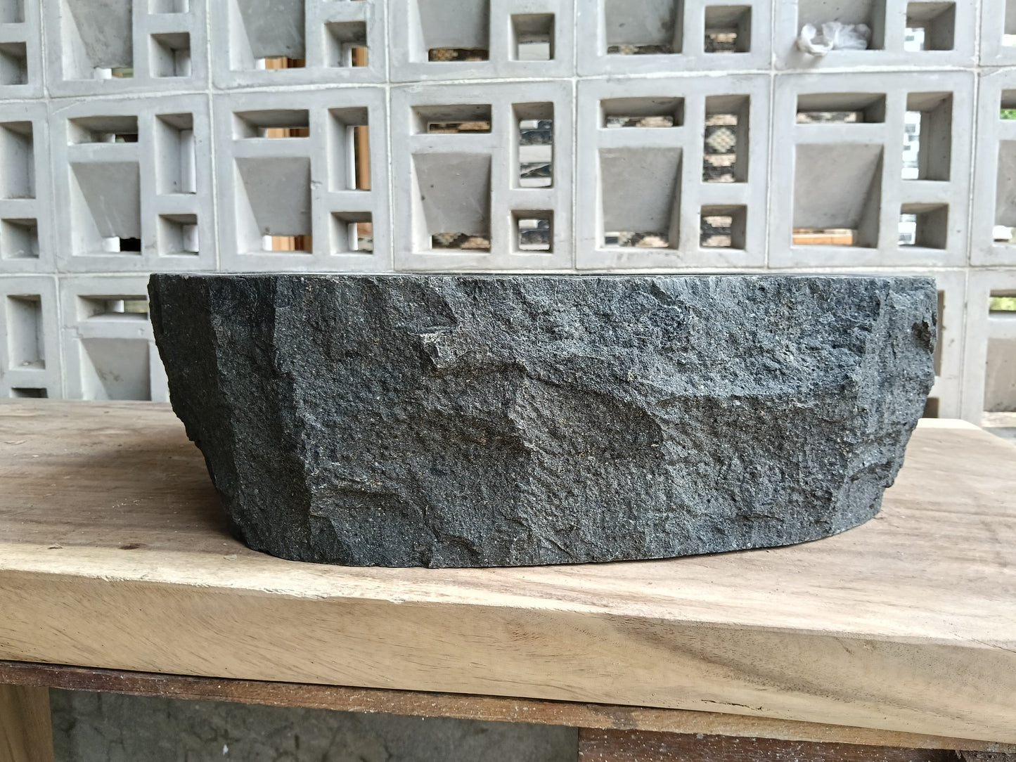 Back view of 6A32-5141 natural andesite basin — textured exterior surface
