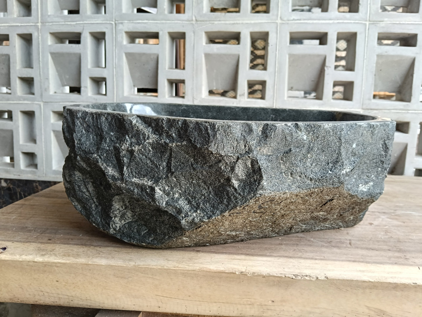 Back view of 6A33-4133 natural andesite basin — textured exterior surface
