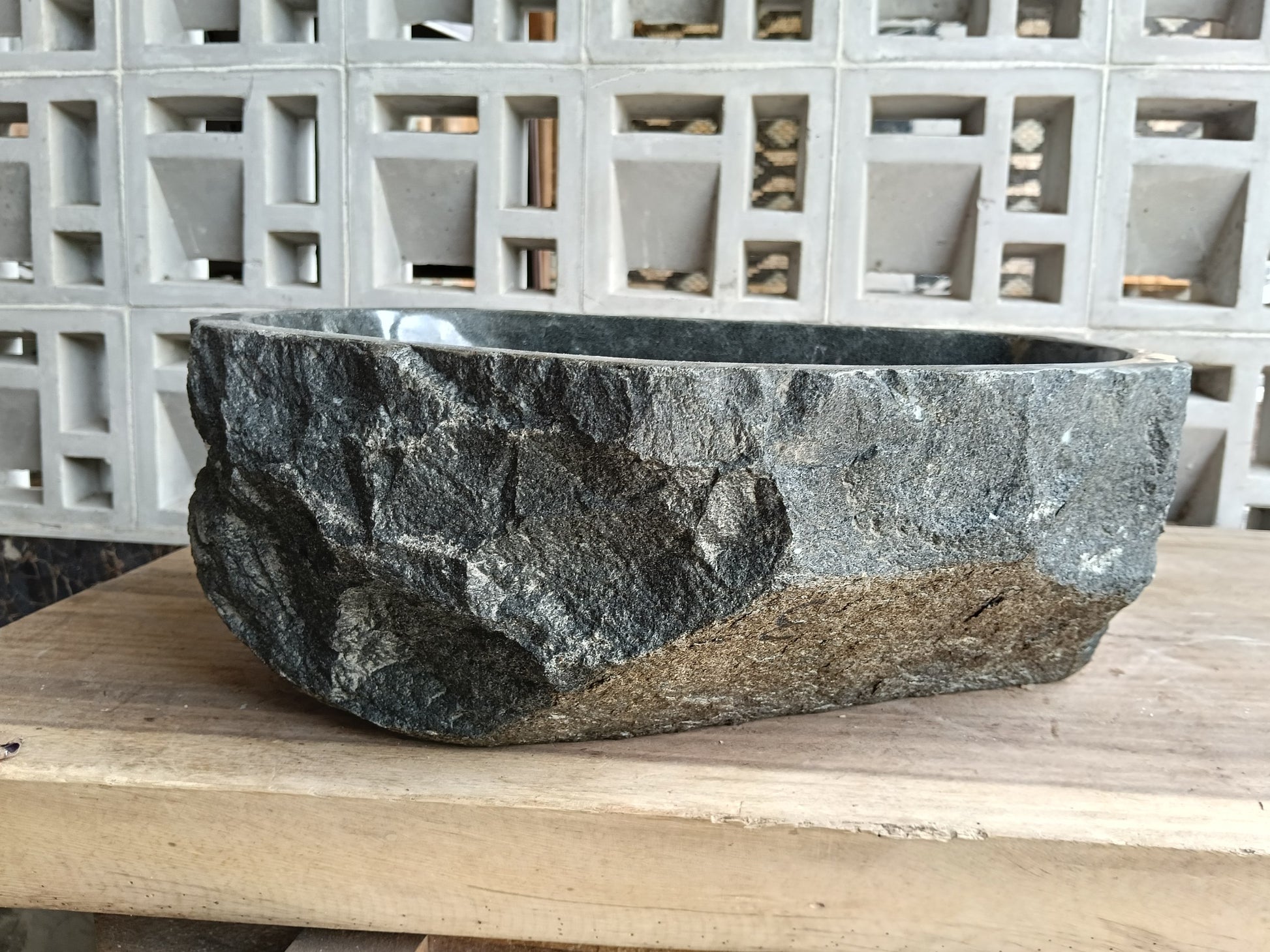 Back view of 6A33-4133 natural andesite basin — textured exterior surface
