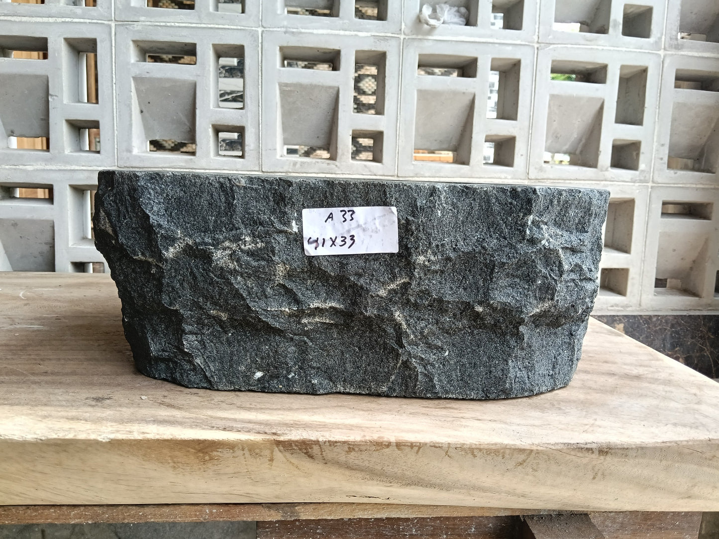 Front view of 6A33-4133 andesite stone vessel — polished interior bowl

