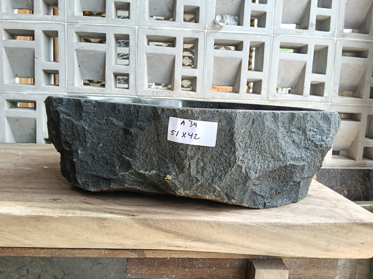 Front view of 6A34-5142 andesite stone vessel — polished interior bowl
