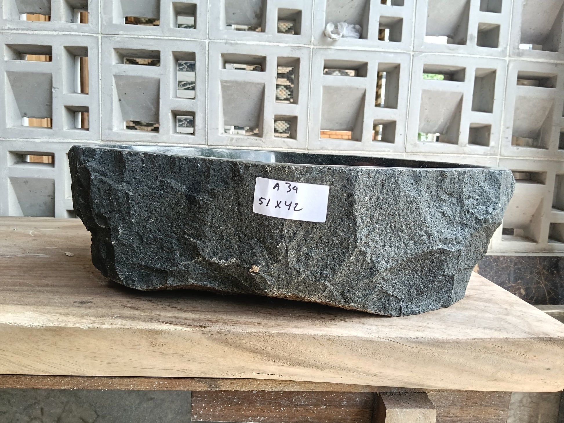 Front view of 6A34-5142 andesite stone vessel — polished interior bowl
