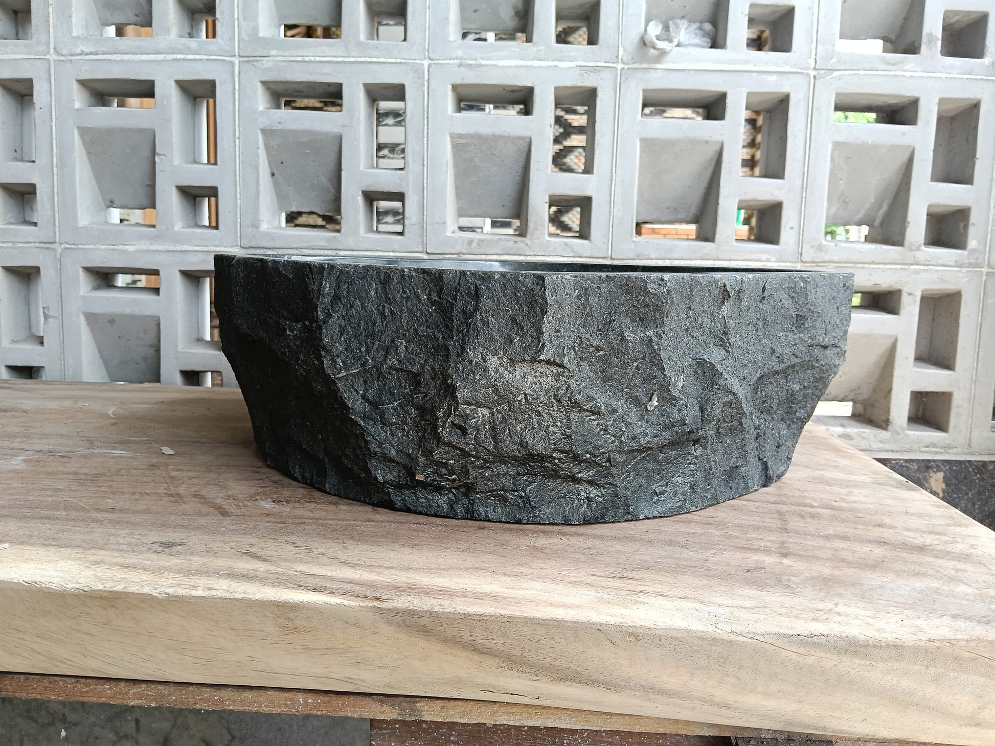 Back view of 6A34-5142 natural andesite basin — textured exterior surface
