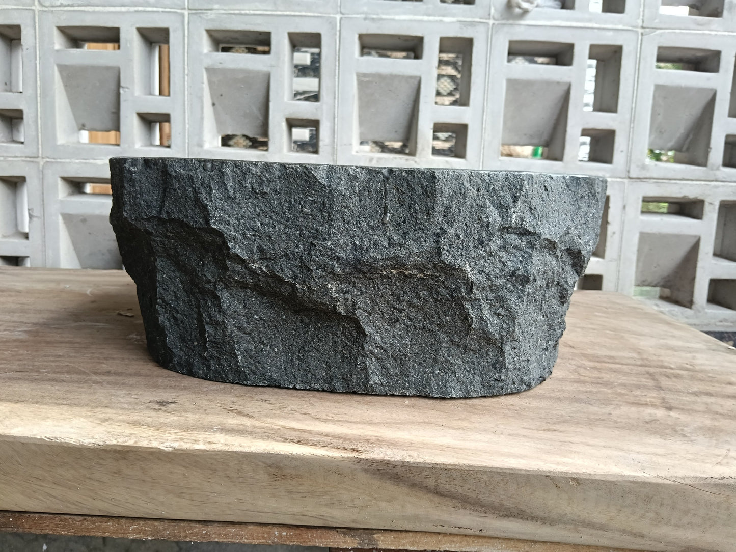 Back view of 6A36-3935 natural andesite basin — textured exterior surface
