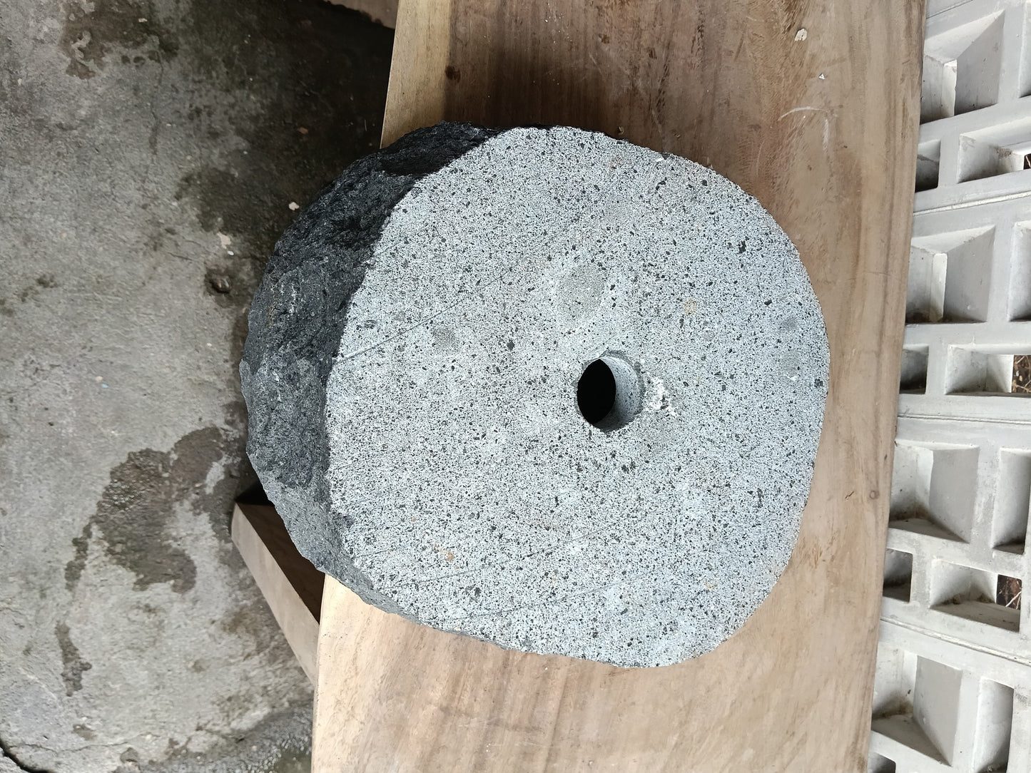 Bottom view of 6A36-3935 solid andesite stone sink — standard drain hole

