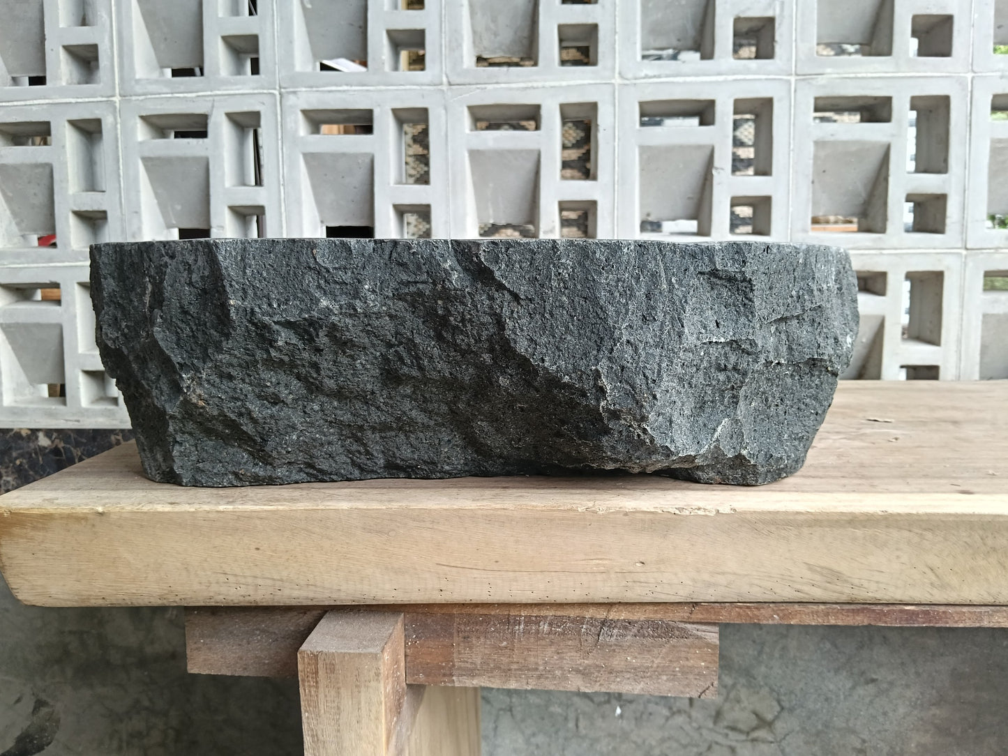 Back view of 6A37-5141 natural andesite basin — textured exterior surface
