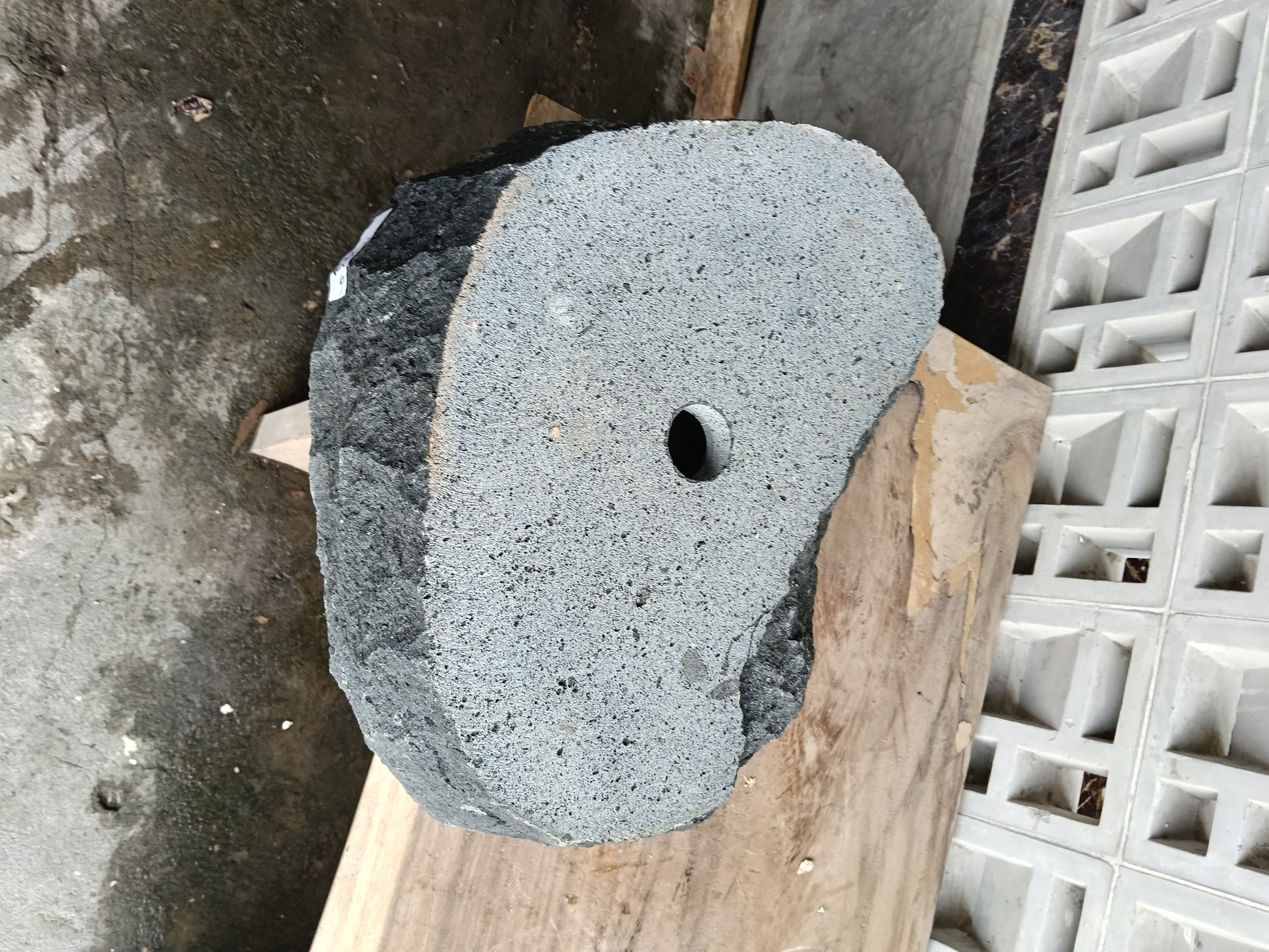 Bottom view of 6A37-5141 solid andesite stone sink — standard drain hole
