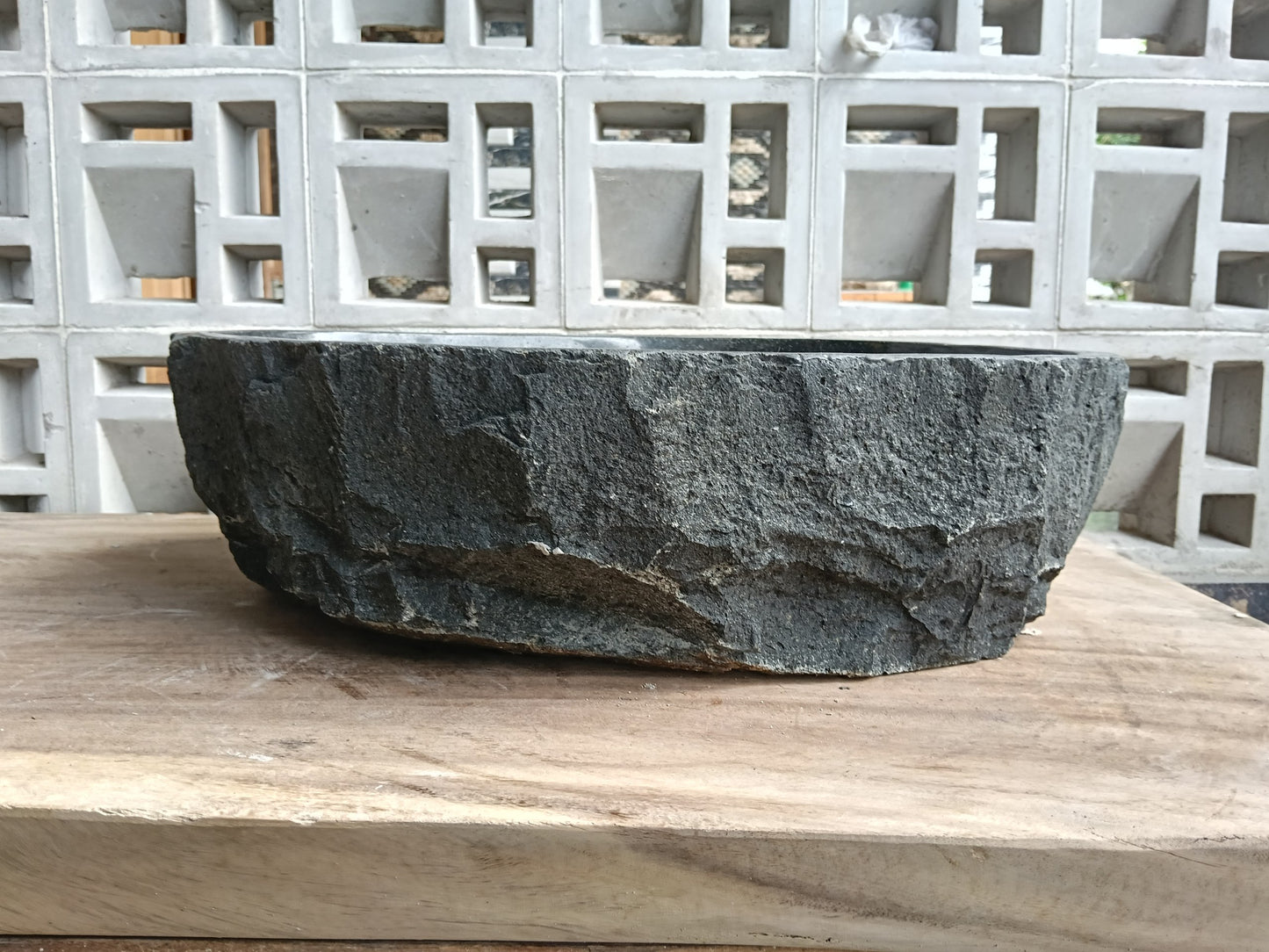 Back view of 6A39-4838 natural andesite basin — textured exterior surface
