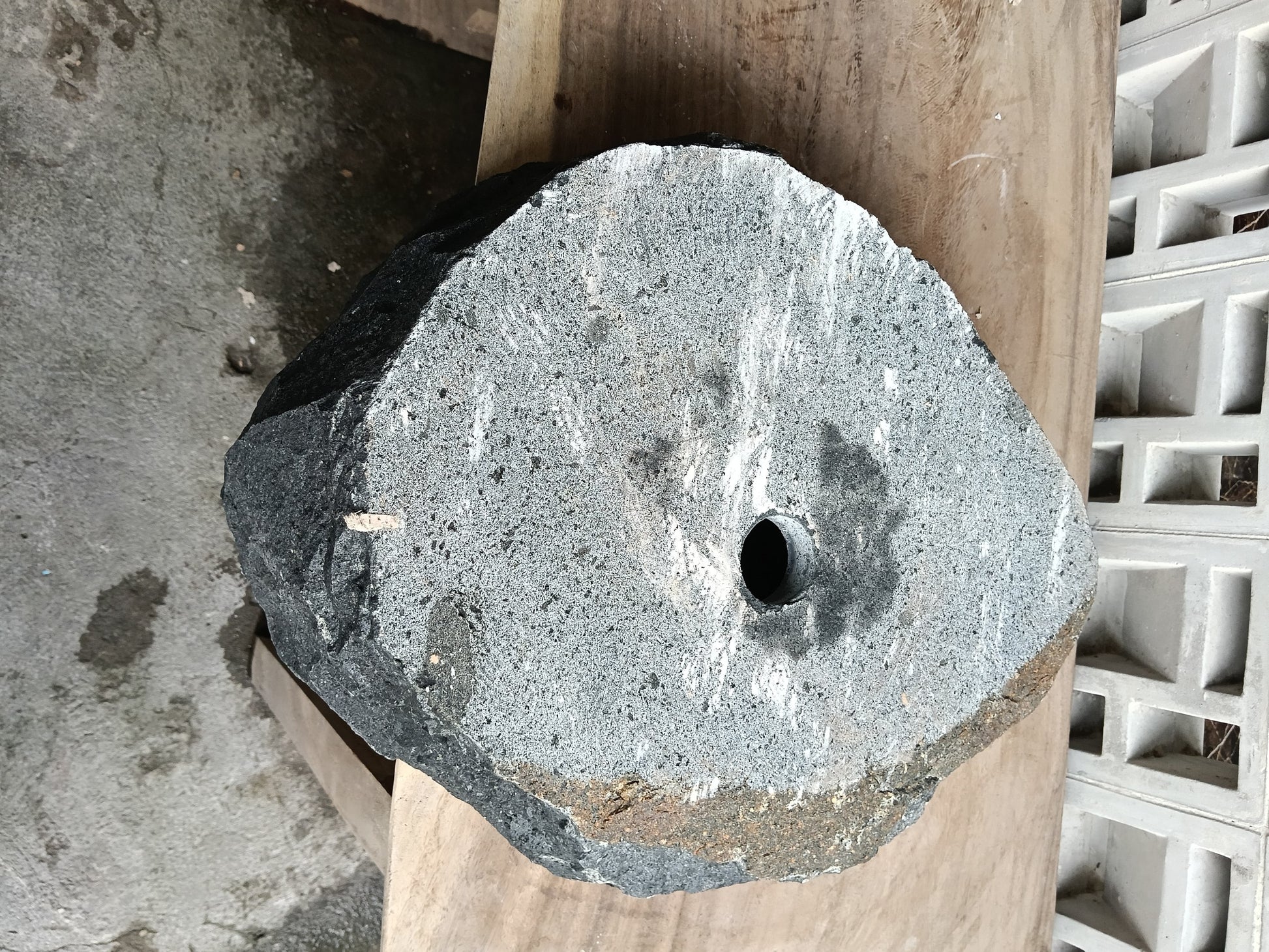 Bottom view of 6A39-4838 solid andesite stone sink — standard drain hole
