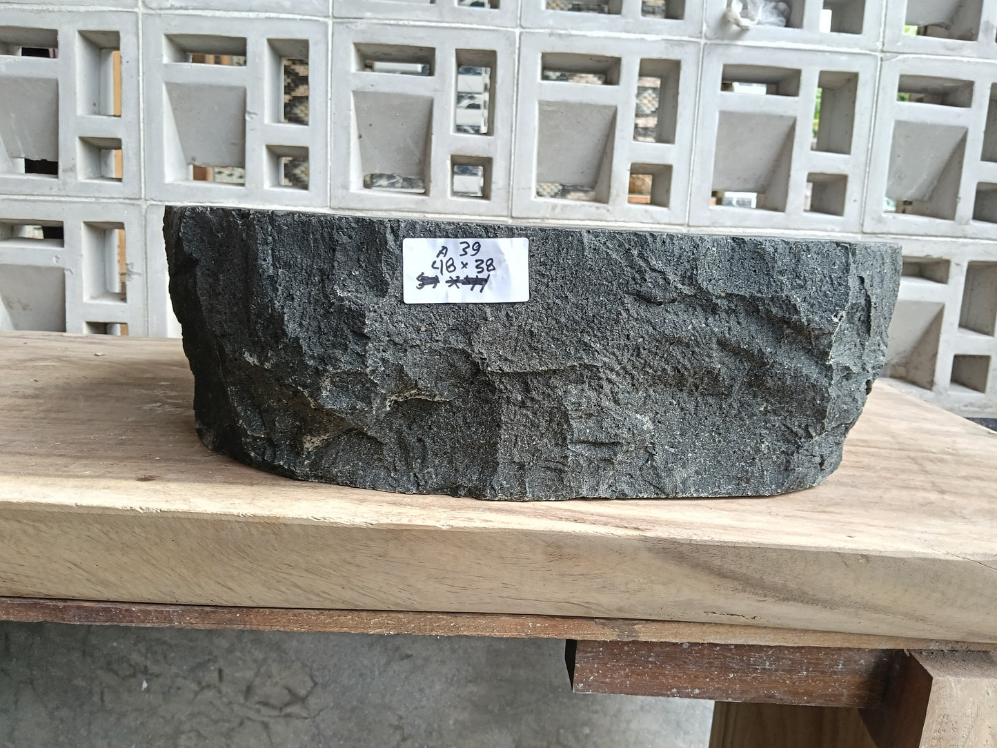 Front view of 6A39-4838 andesite stone vessel — polished interior bowl
