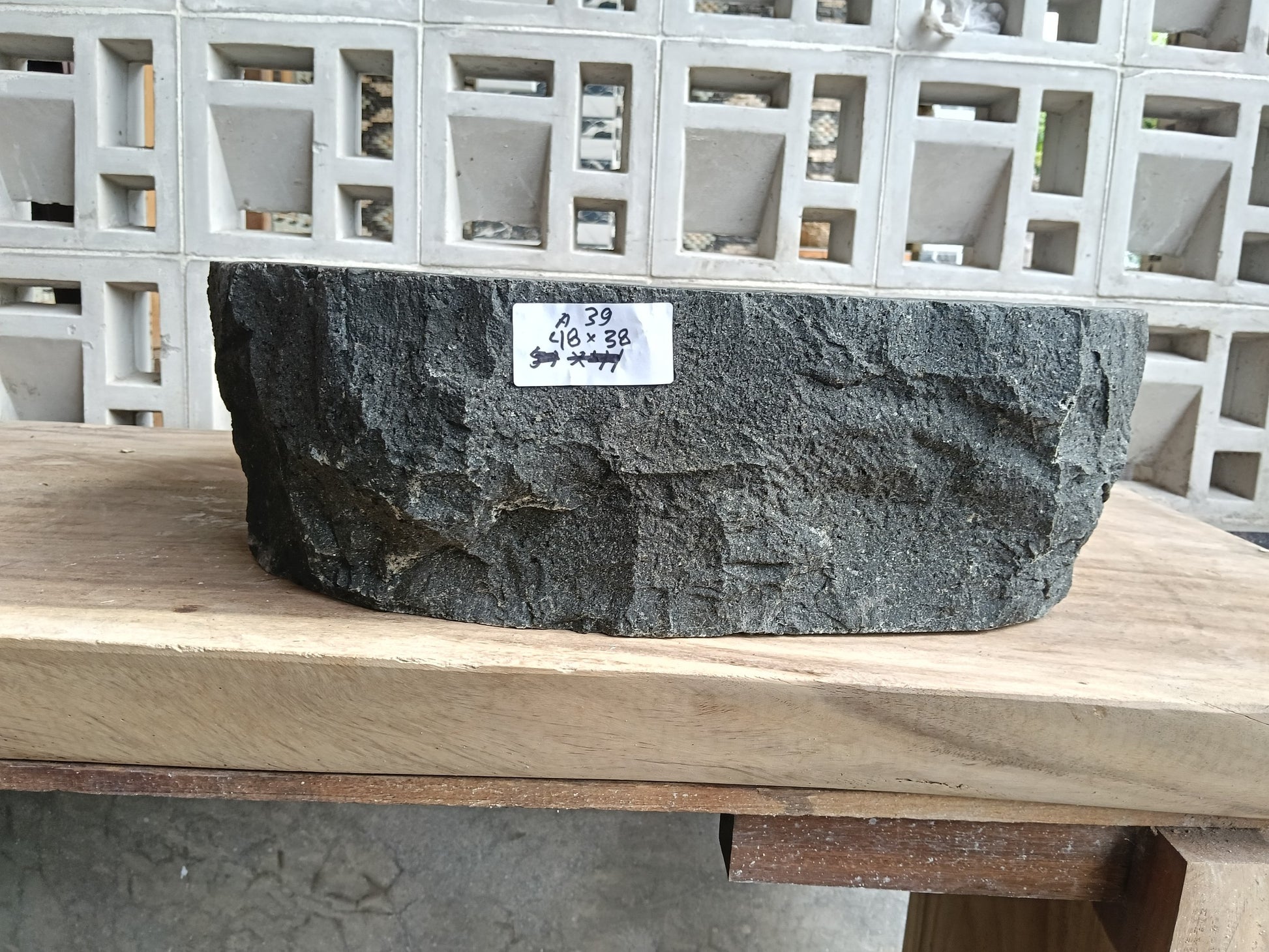 Front view of 6A39-4838 andesite stone vessel — polished interior bowl
