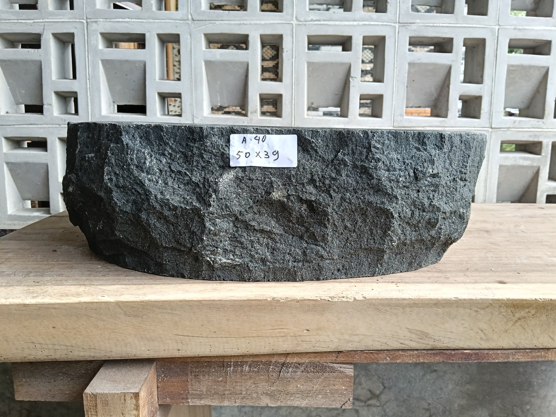 Front view of 6A40-5039 andesite stone vessel — polished interior bowl
