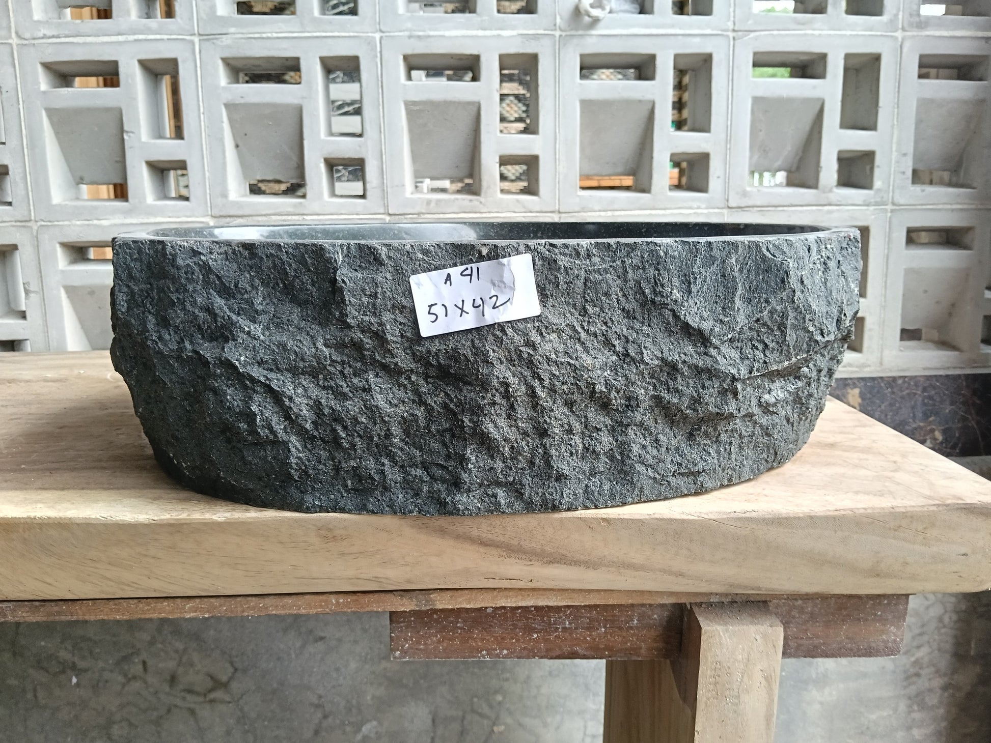 Front view of 6A41-5142 andesite stone vessel — polished interior bowl
