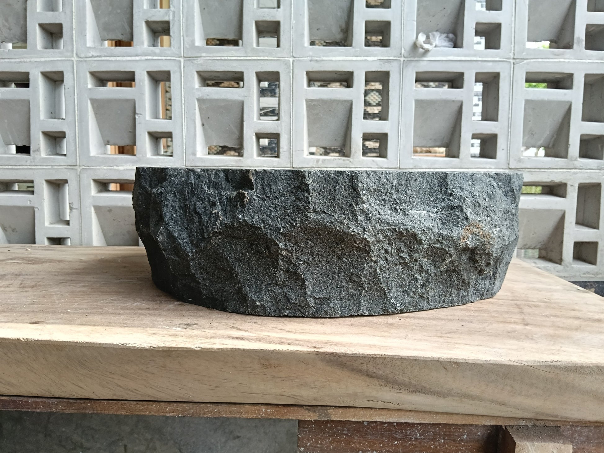 Back view of 6A41-5142 natural andesite basin — textured exterior surface
