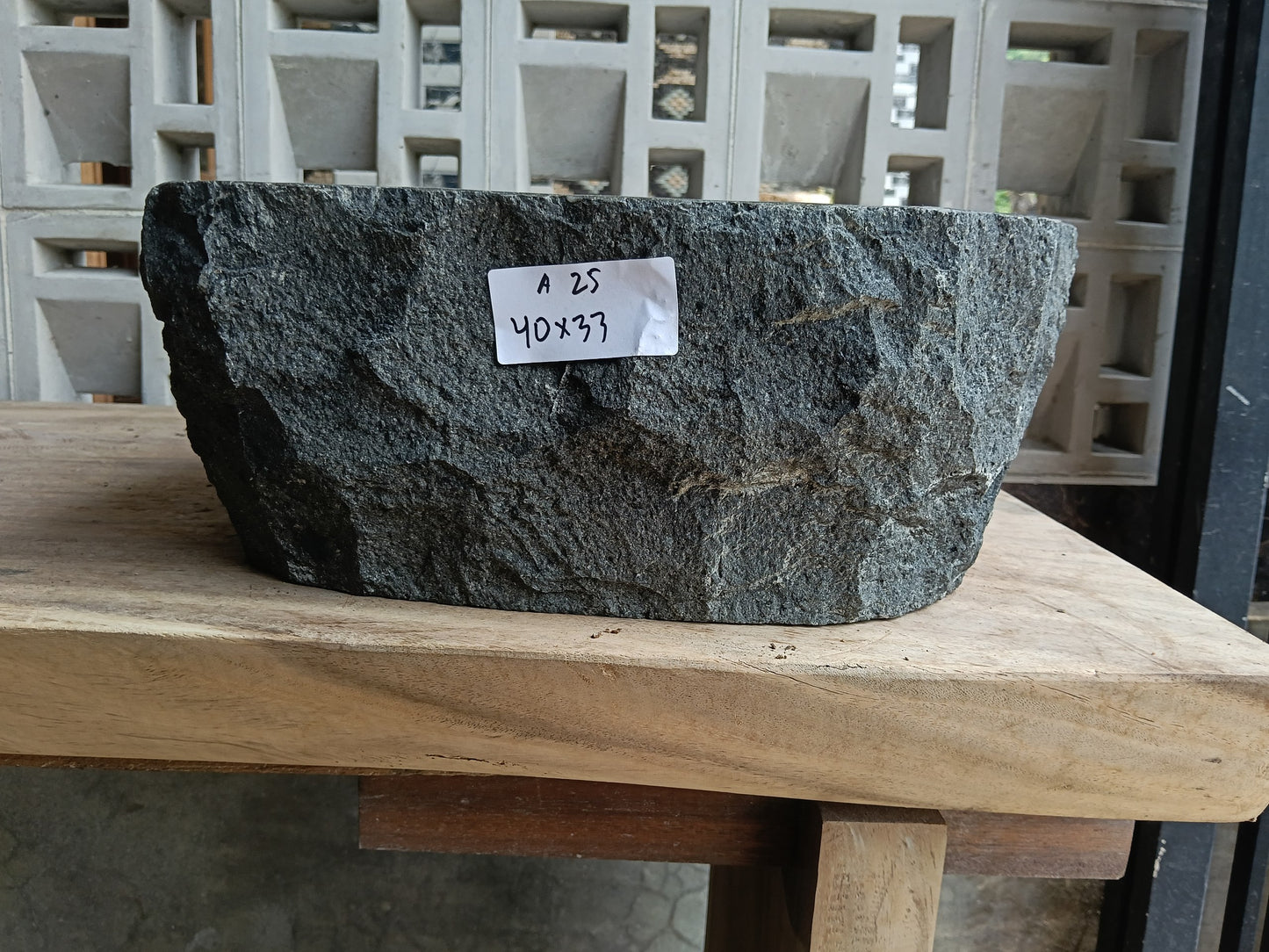 Front view of 6A25-4033 andesite stone vessel — polished interior bowl
