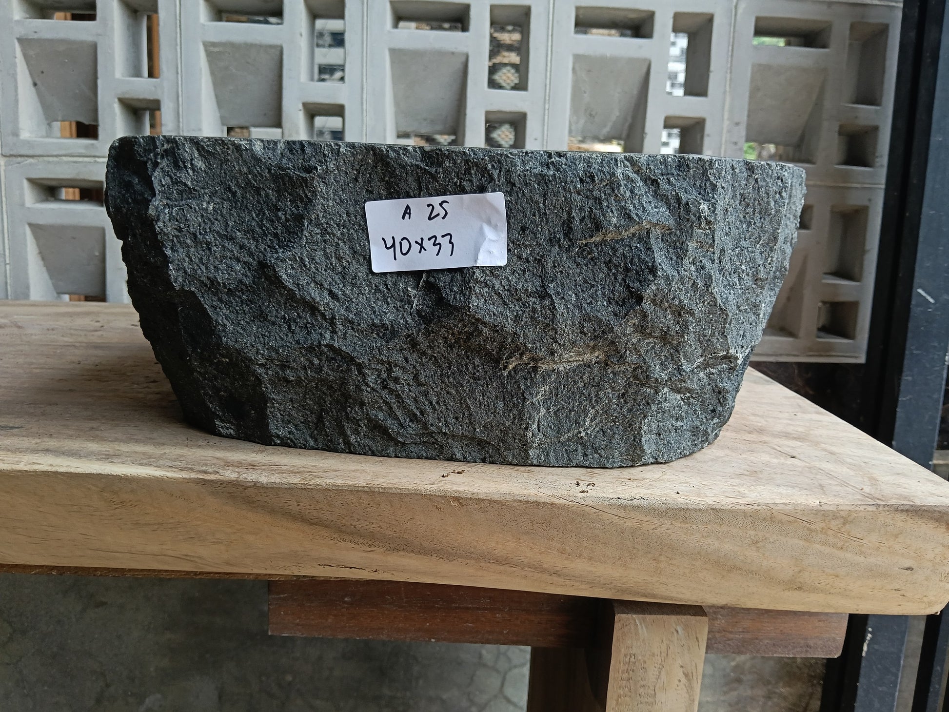 Front view of 6A25-4033 andesite stone vessel — polished interior bowl
