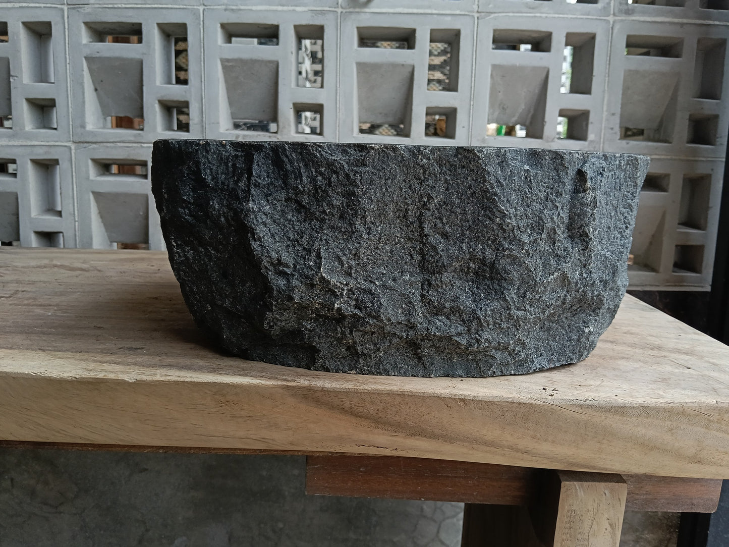 Back view of 6A25-4033 natural andesite basin — textured exterior surface
