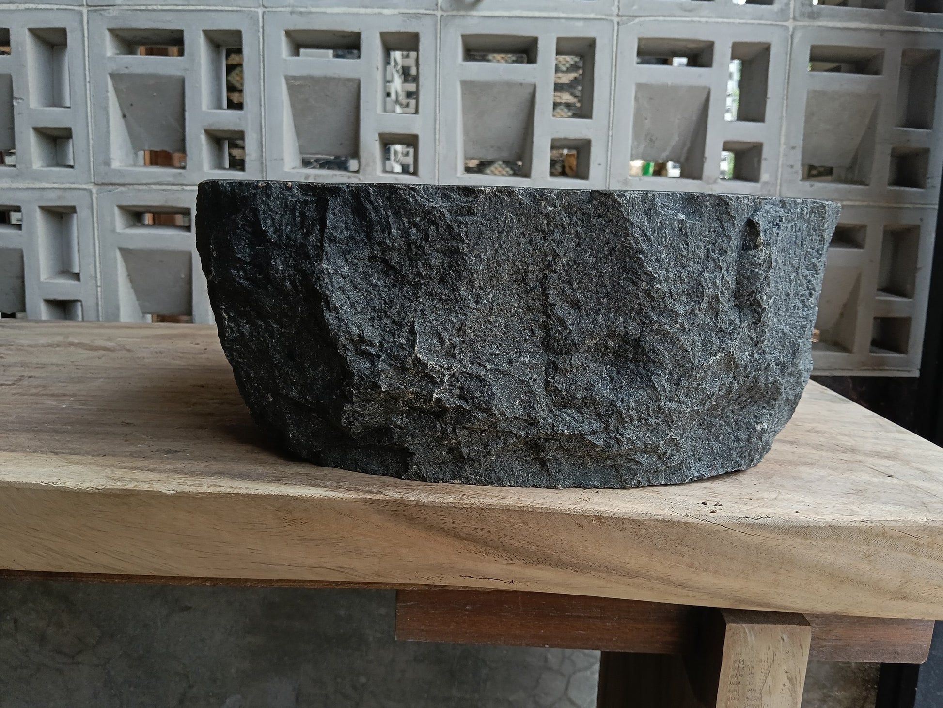 Back view of 6A25-4033 natural andesite basin — textured exterior surface
