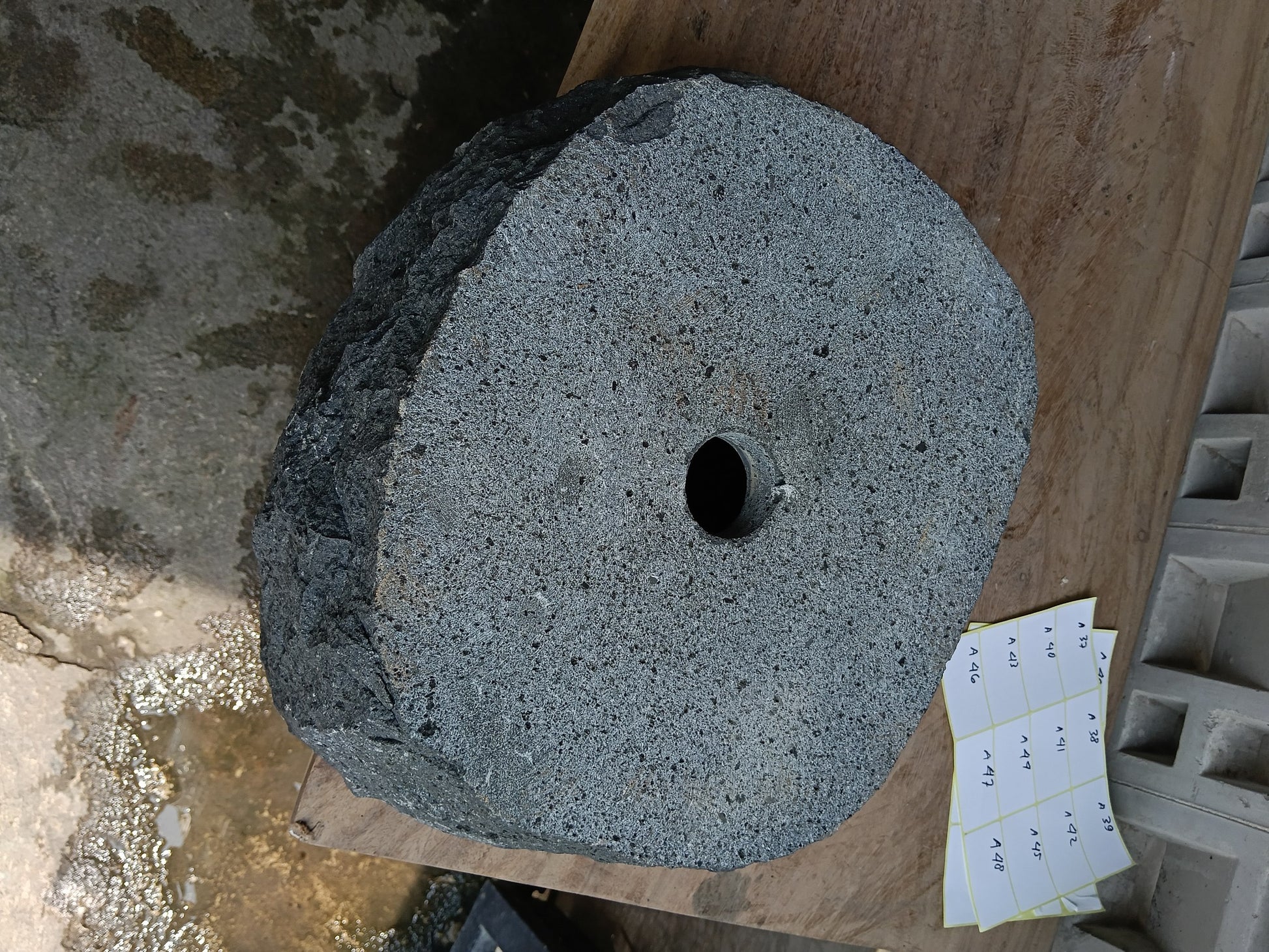 Bottom view of 6A25-4033 solid andesite stone sink — standard drain hole
