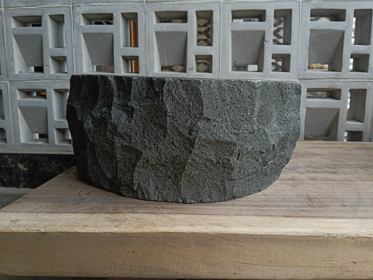 Back view of 6A20-4137 natural andesite basin — textured exterior surface
