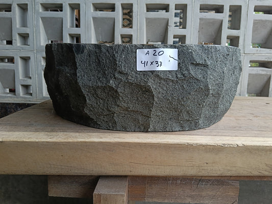 Front view of 6A20-4137 andesite stone vessel — polished interior bowl
