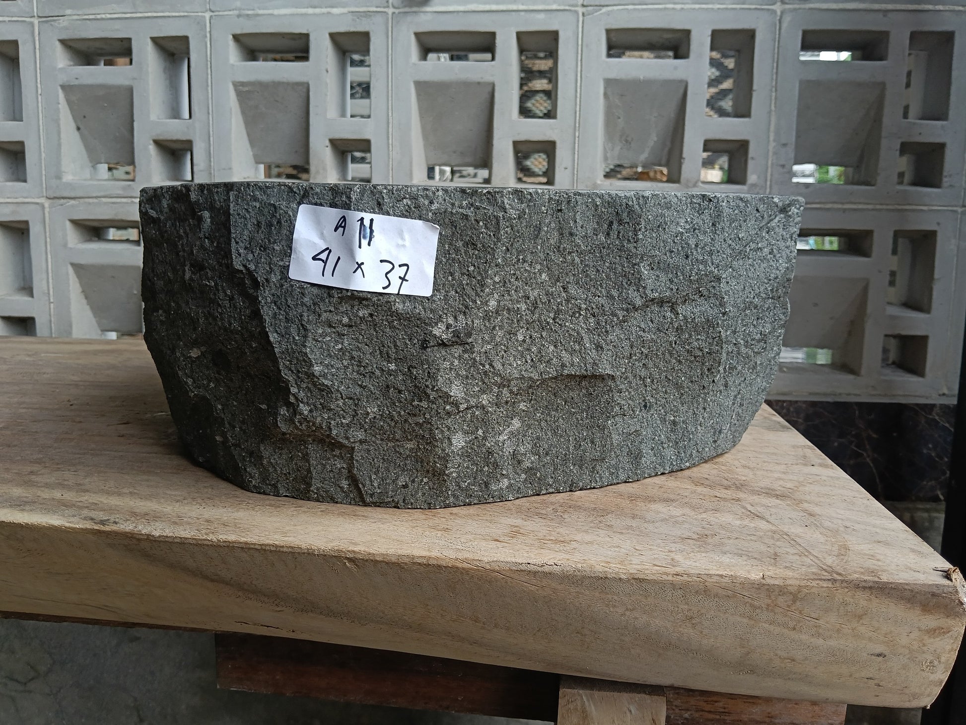 Front view of 6A11-4137 andesite stone vessel — polished interior bowl
