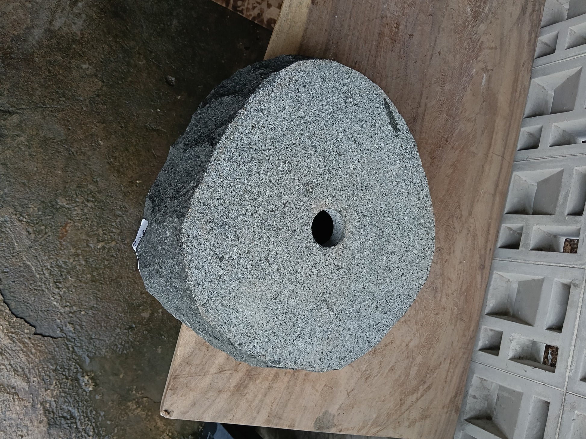 Bottom view of 6A11-4137 solid andesite stone sink — standard drain hole
