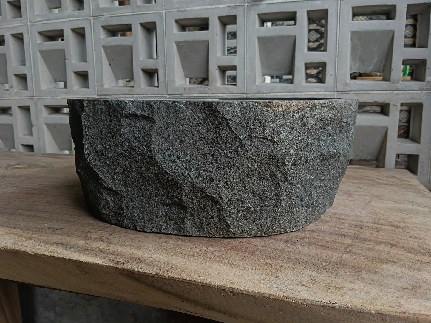 Back view of 6A11-4137 natural andesite basin — textured exterior surface
