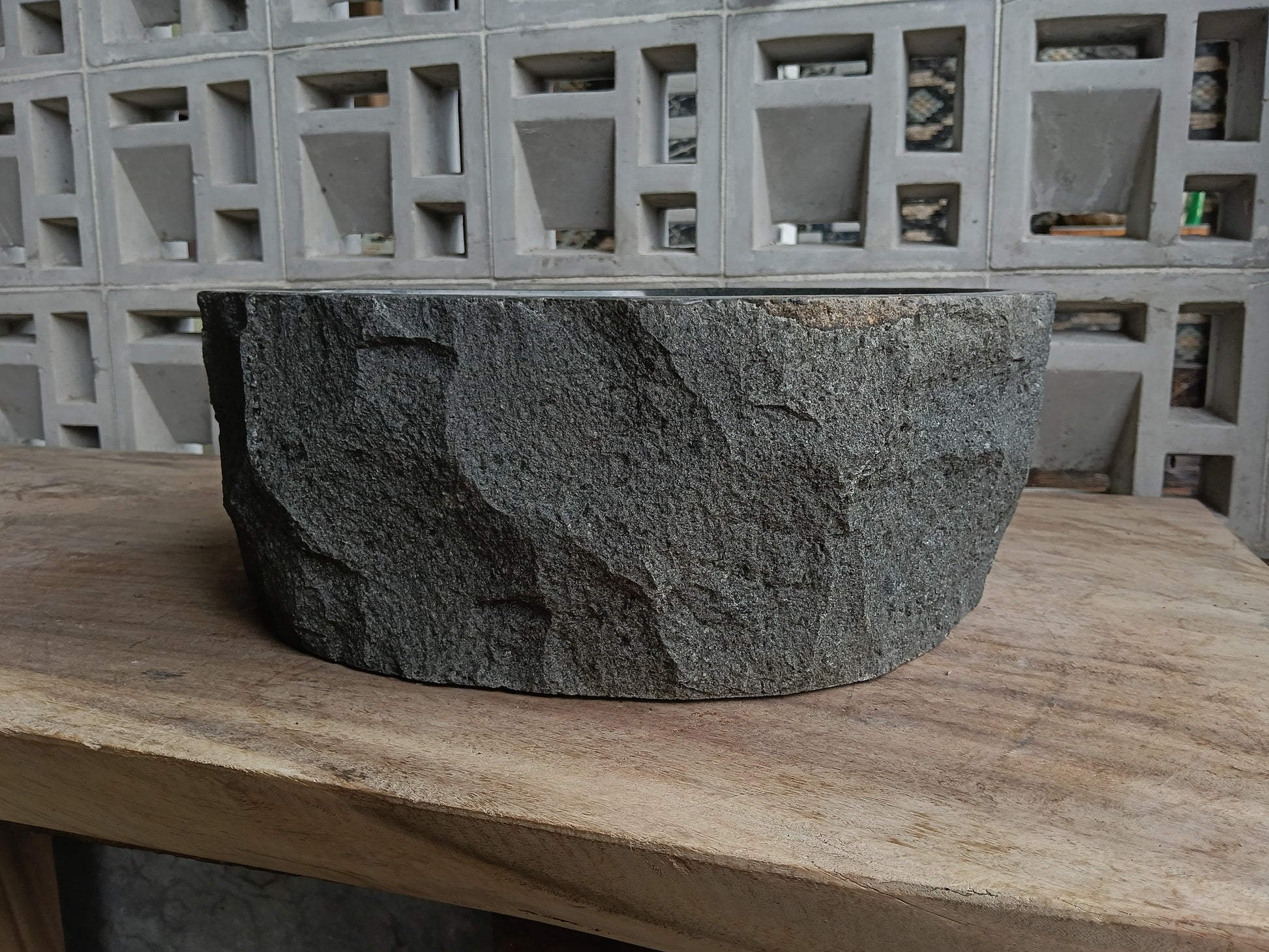 Back view of 6A11-4137 natural andesite basin — textured exterior surface
