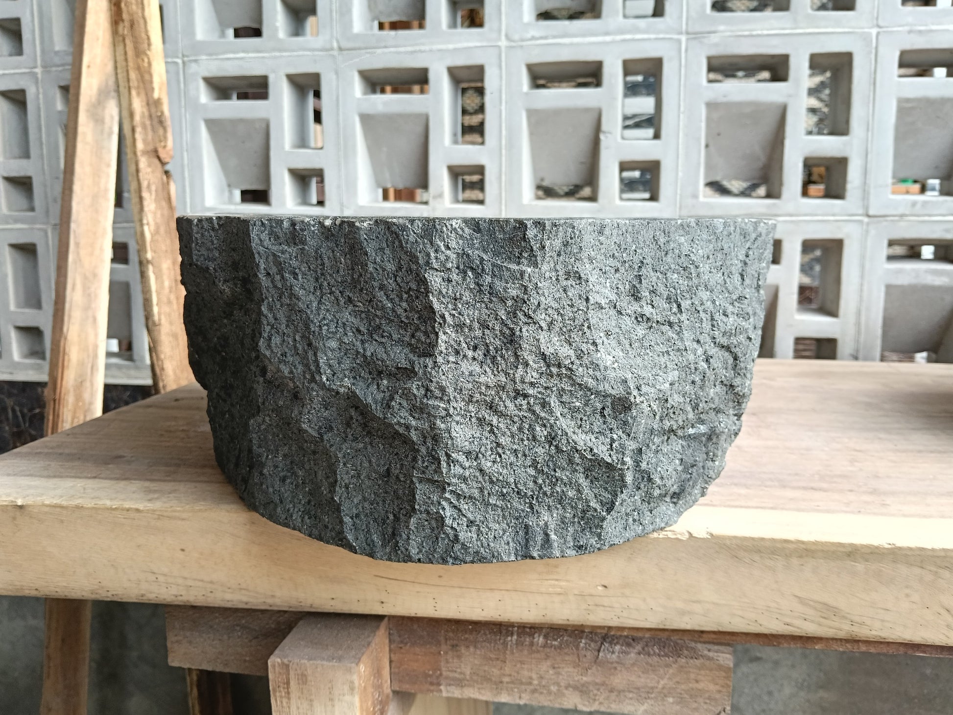 Left side of 6A5-4237 round andesite stone sink
