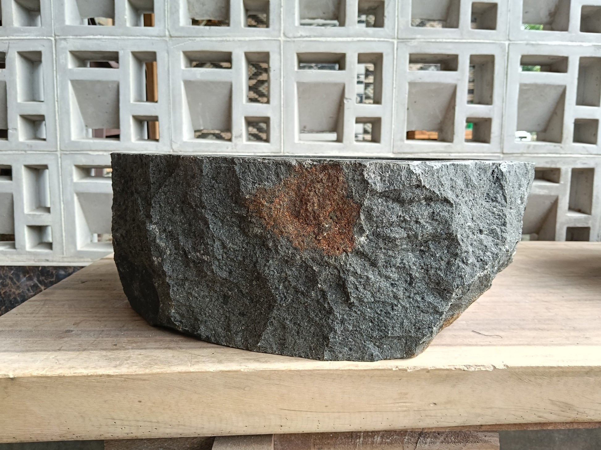 Back view of 6A5-4237 natural andesite basin — textured exterior surface
