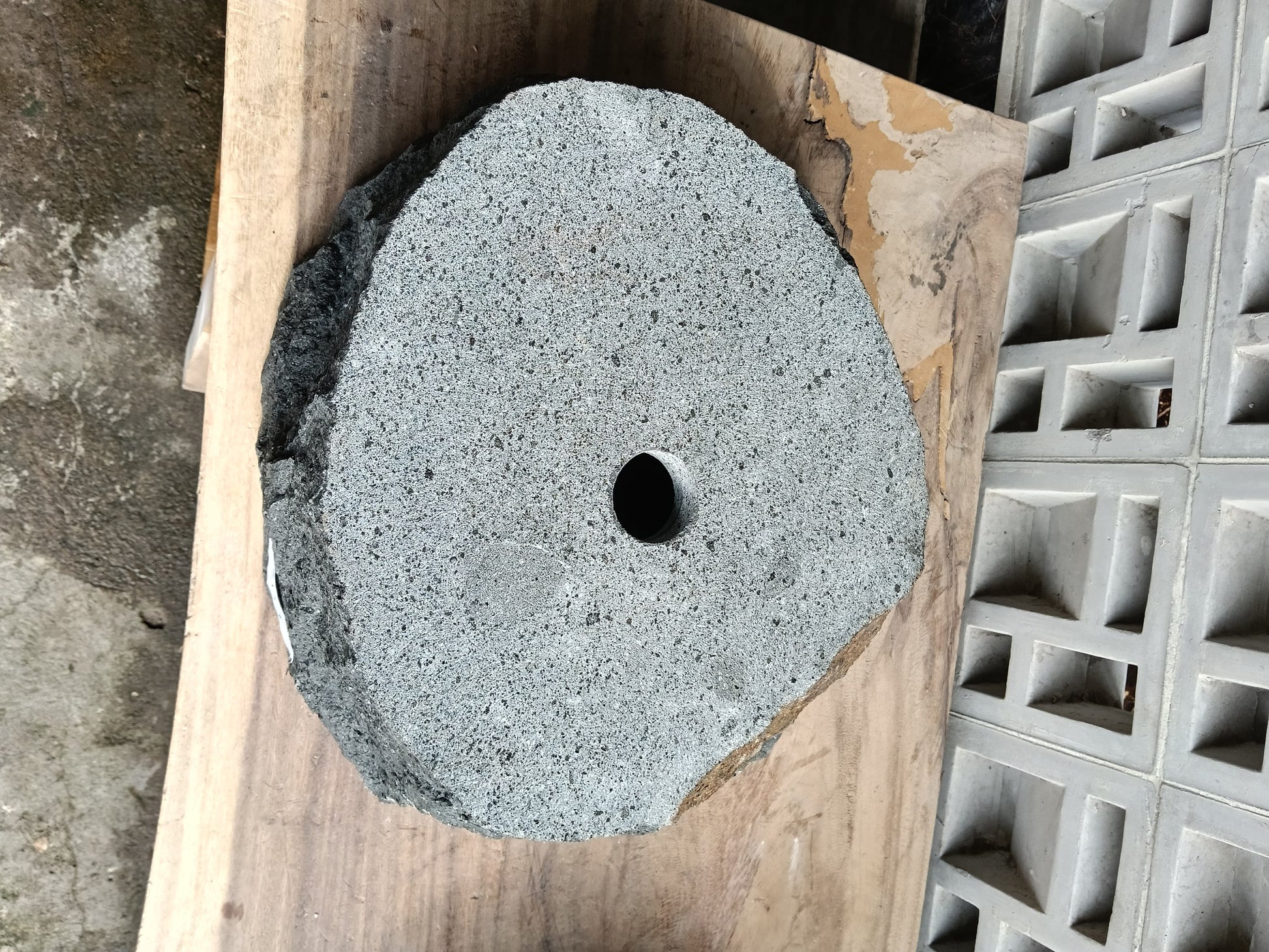 Bottom view of 6A5-4237 solid andesite stone sink — standard drain hole
