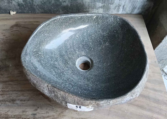 Top view of handcrafted 16×14 inch gray river stone sink with irregular interior shape
