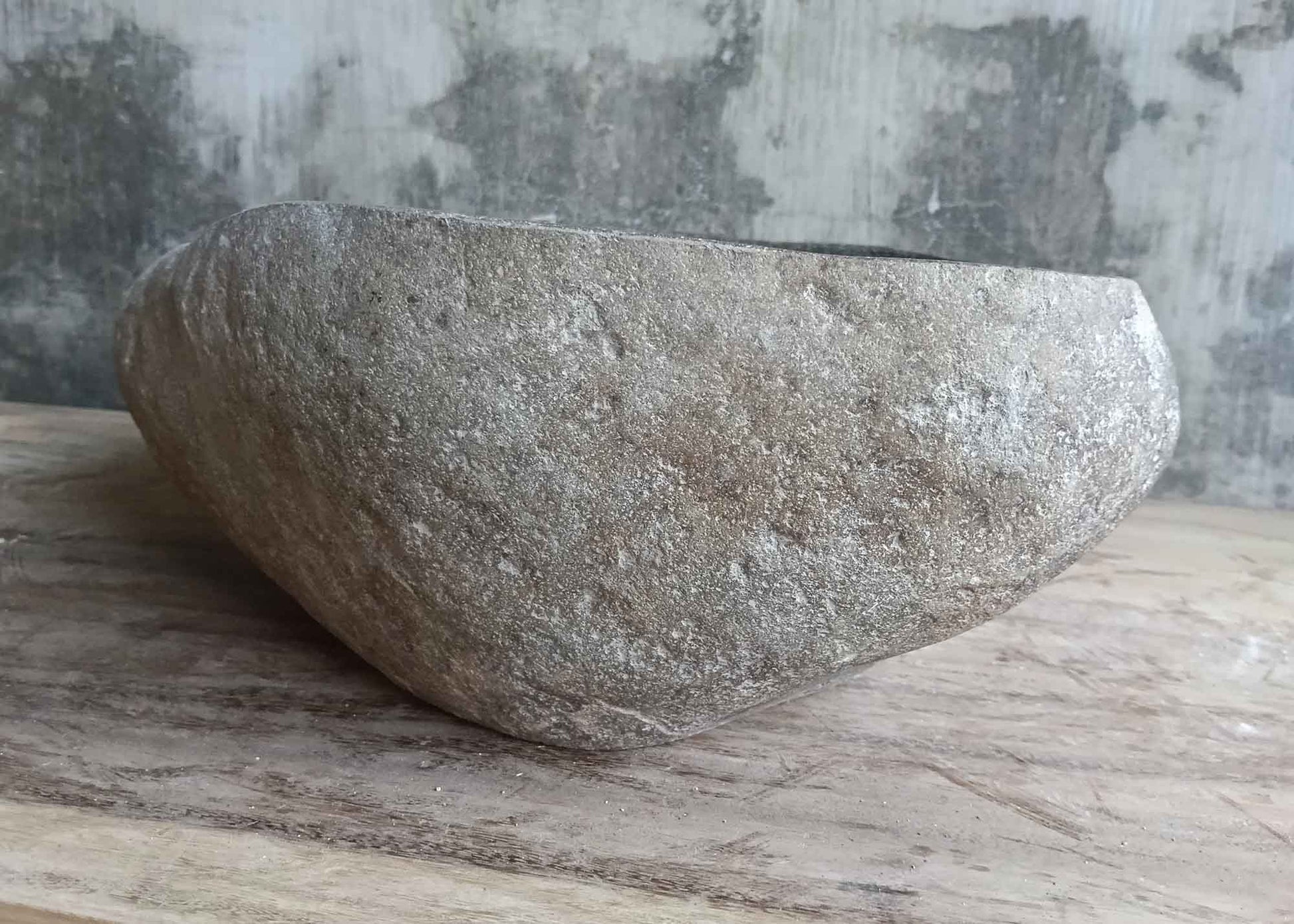 Back side of 16×14 inch gray river stone sink showing irregular natural exterior
