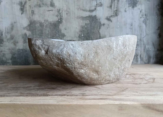 Front side view of gray 16×14 inch river stone sink with rugged natural edge
