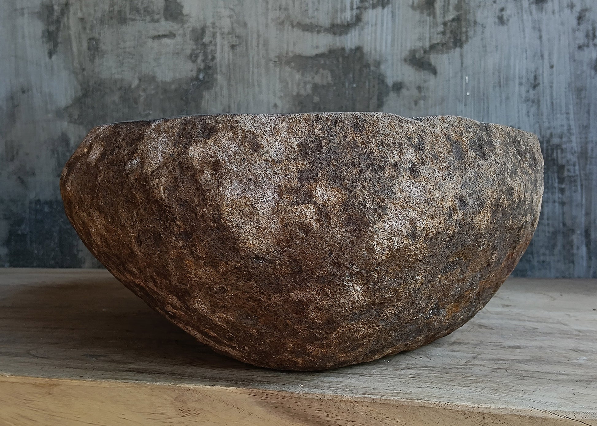Left side view of polished oval dark brown river stone vessel sink 6600-1824
