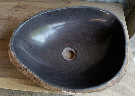 Top view of oval dark brown river stone sink 6600-1824 with polished interior
