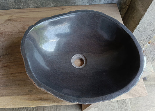 Top view of oval dark brown river stone sink 6636-4638 with polished interior
