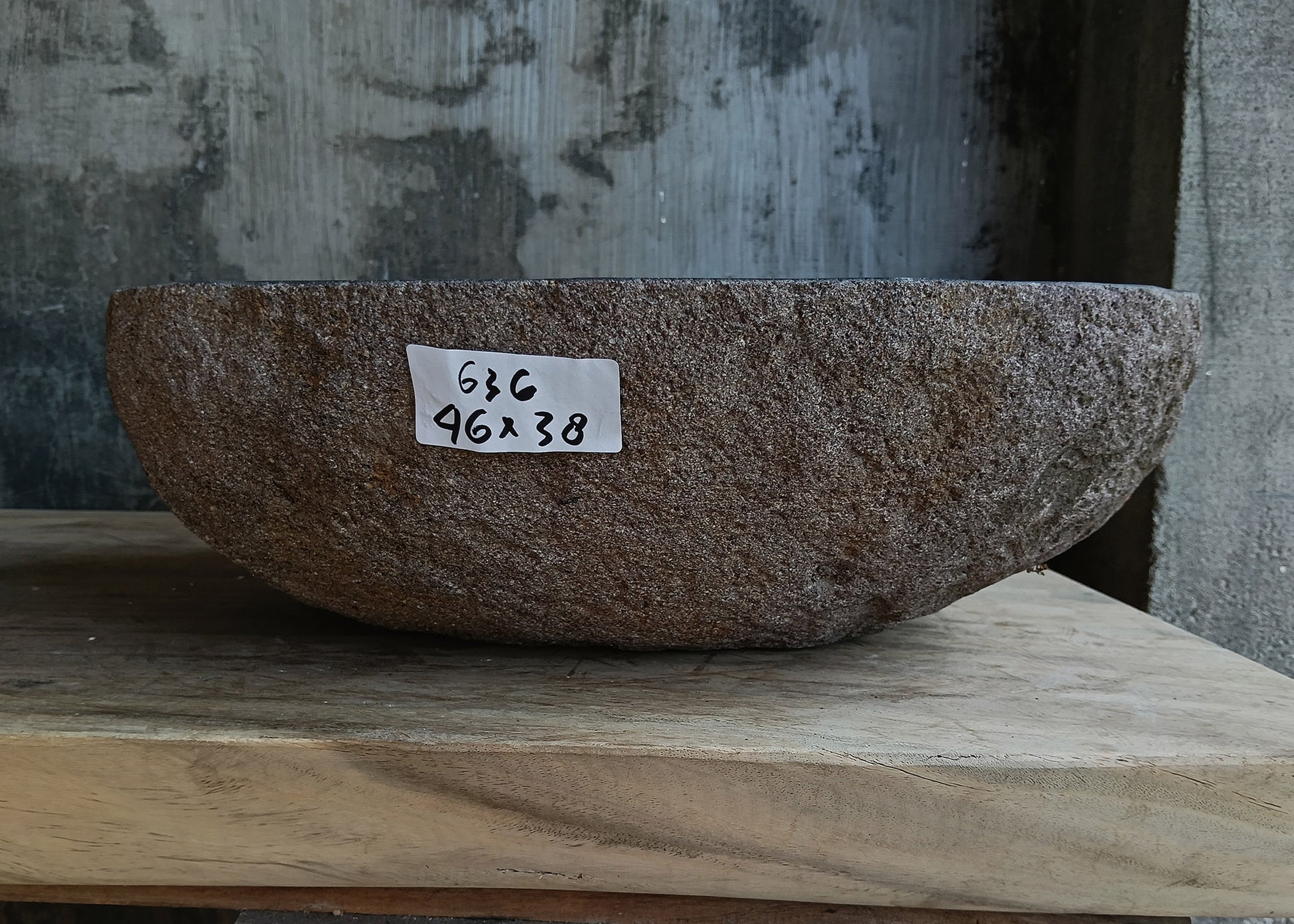 Front view of handcrafted dark brown oval river stone sink 6636-4638

