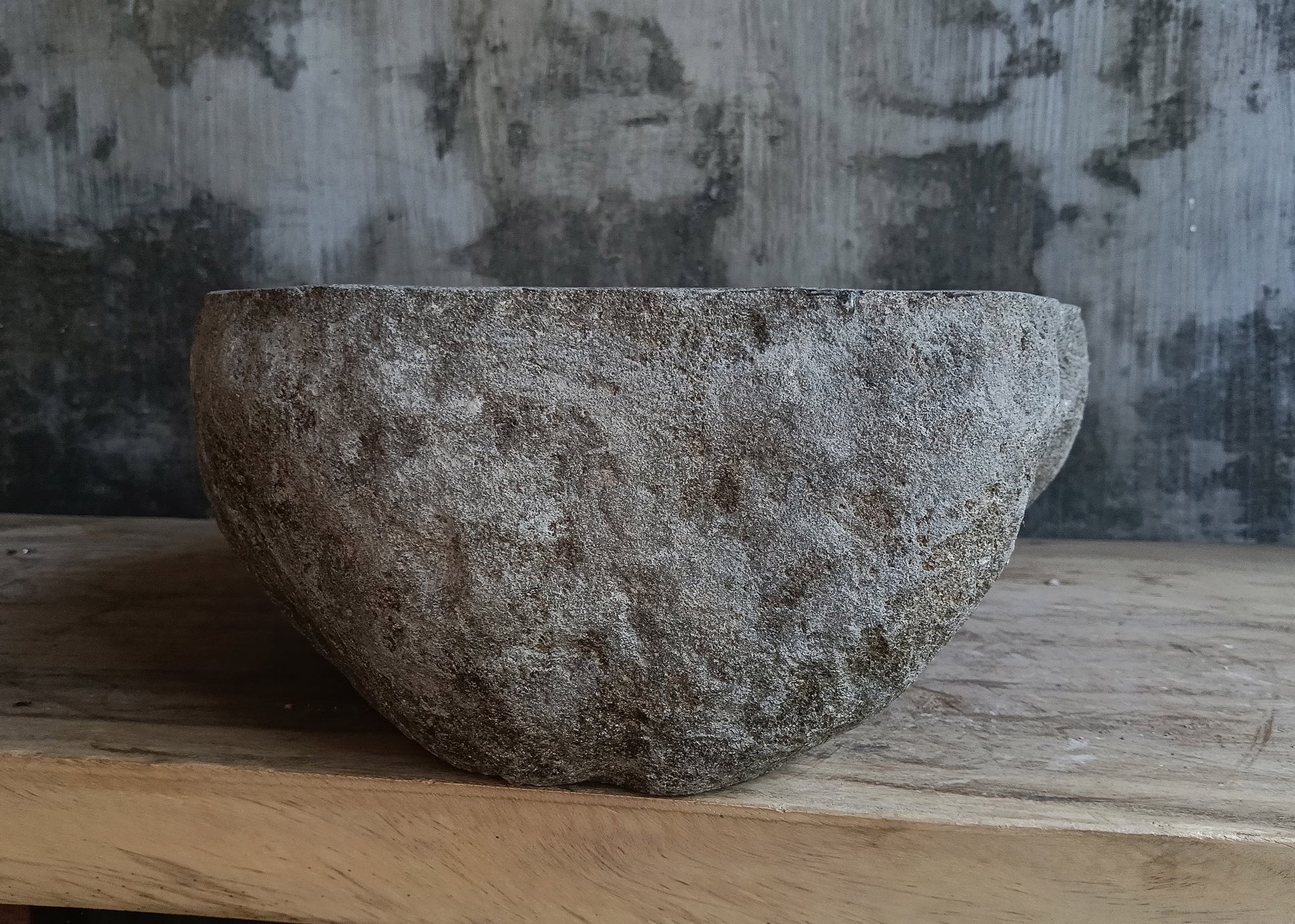 Left side view of rectangular dark gray river stone sink 6638-4437 with rough exterior
