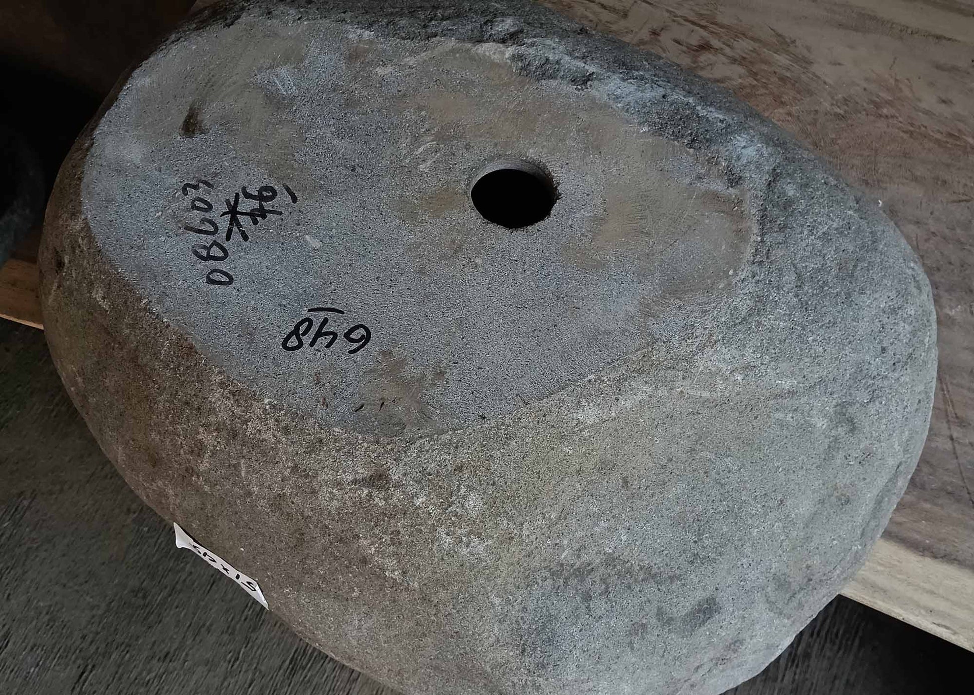 Bottom view of handcrafted oval dark gray river stone sink 6648-5145
