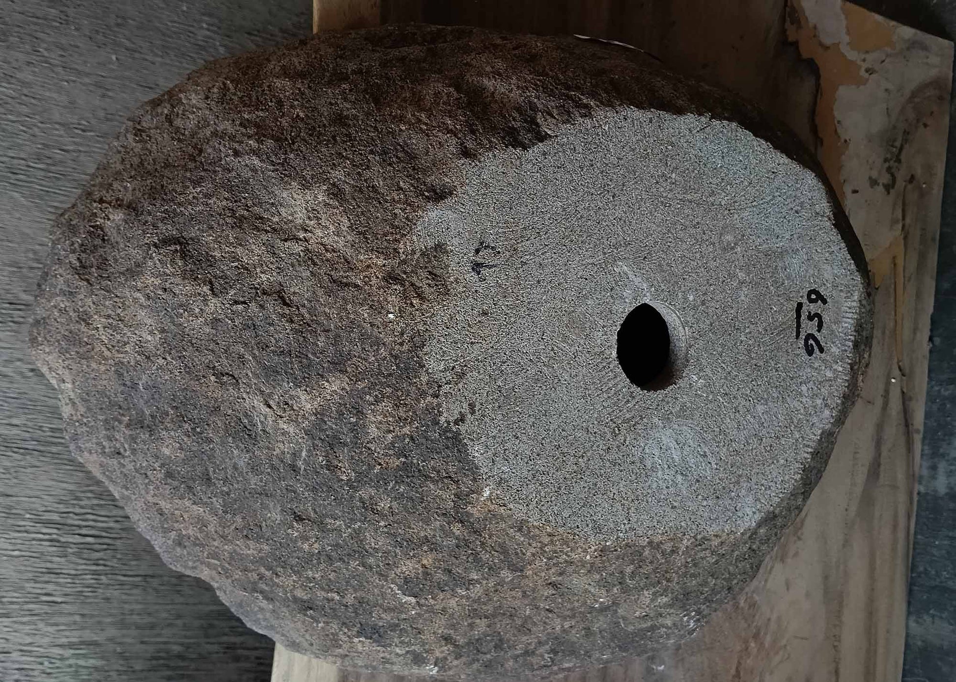 Bottom view of handcrafted oval light brown river stone sink 6656-5643
