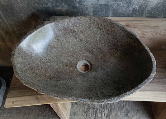 Top view of oval light brown river stone sink 6656-5643 with polished interior
